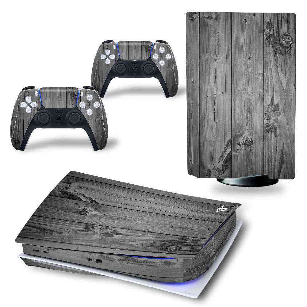 Gaming console and controllers with wood-texture skin on a white background