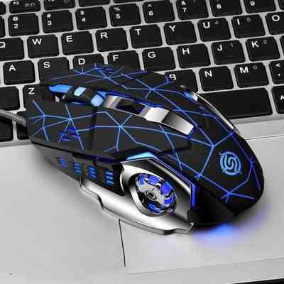 Gaming mouse with blue lights on a laptop keyboard