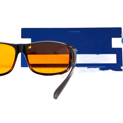 Sunglasses with orange lenses and black frame on a blue and white background