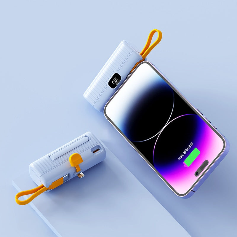 Phone with a power bank on a light blue background
