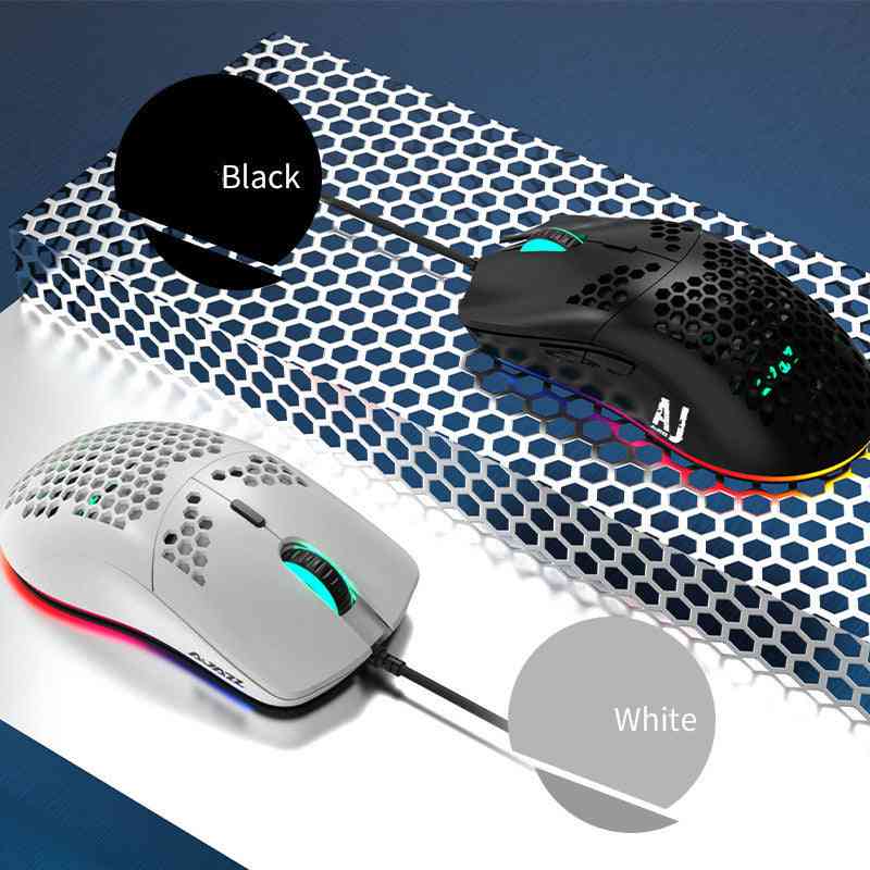 Two gaming mice, one black and one white, on a textured surface.