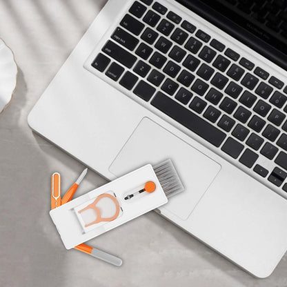 Laptop with cleaning tools on a desk