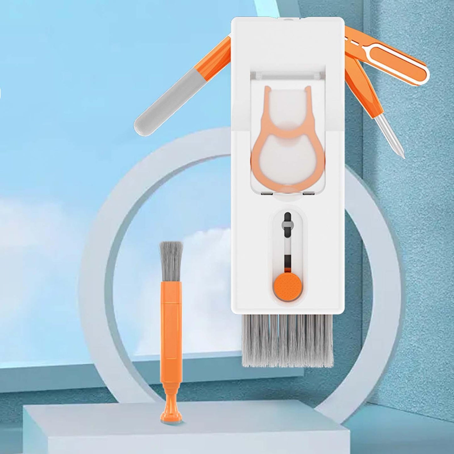 Set of cleaning tools including a brush, scrubber, and small tool on a blue background