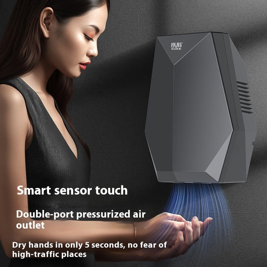 Woman using a smart hand dryer with text highlighting features
