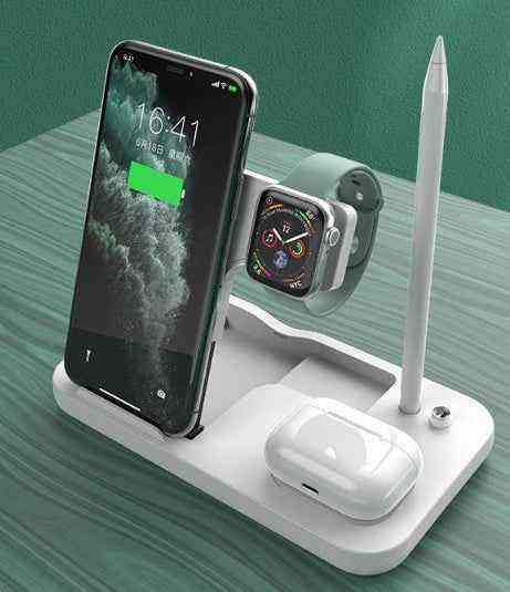 Multi-device charging stand with phone, watch, and airpods on a green surface