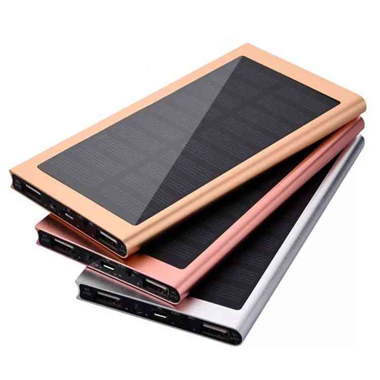 Stack of solar-powered portable chargers on a white background