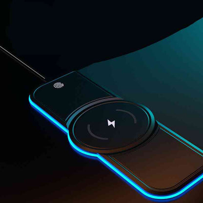 Smartphone with a magnetic phone holder attached, glowing with blue light on a dark background