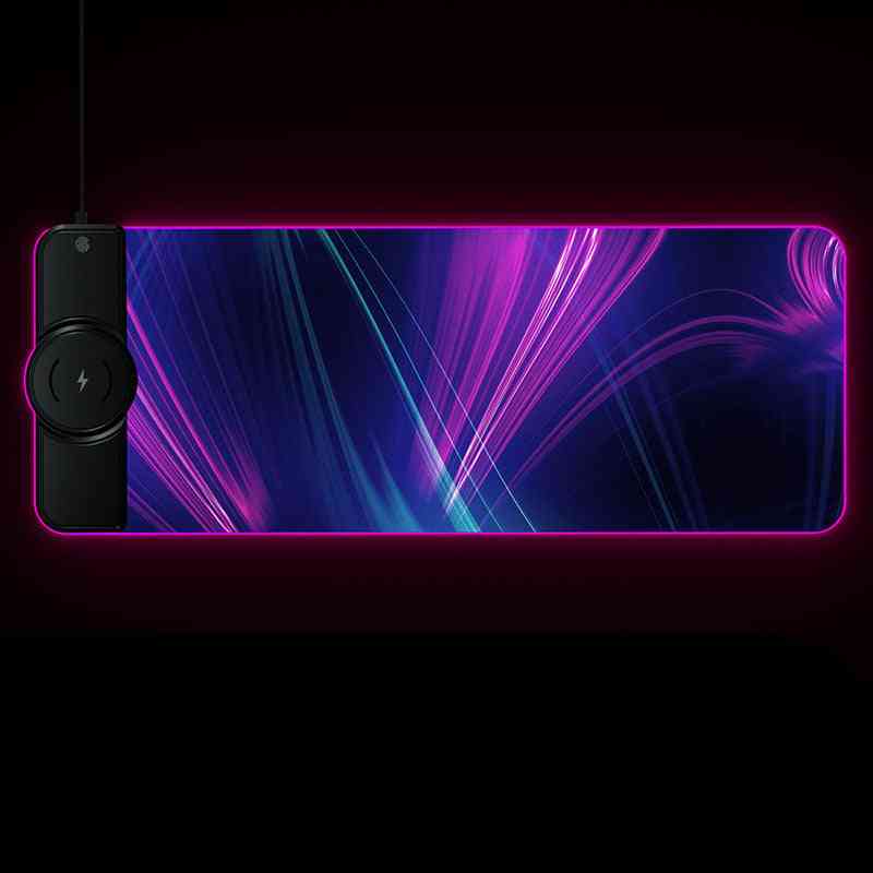 Gaming mouse pad with LED lighting and wireless charging pad on a black background