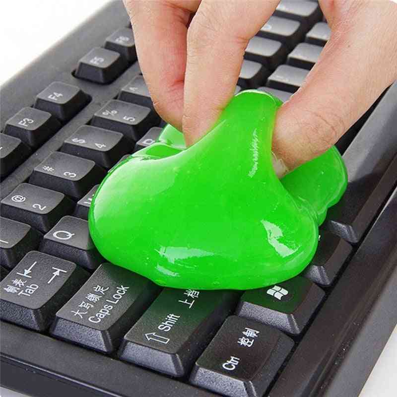 Green putty being used on a keyboard
