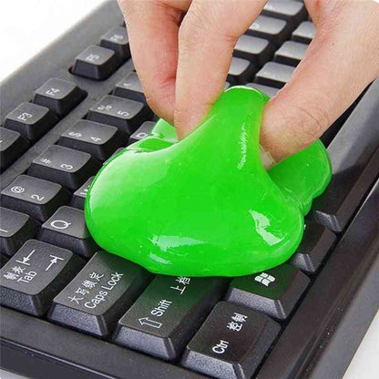Green putty being used on a keyboard