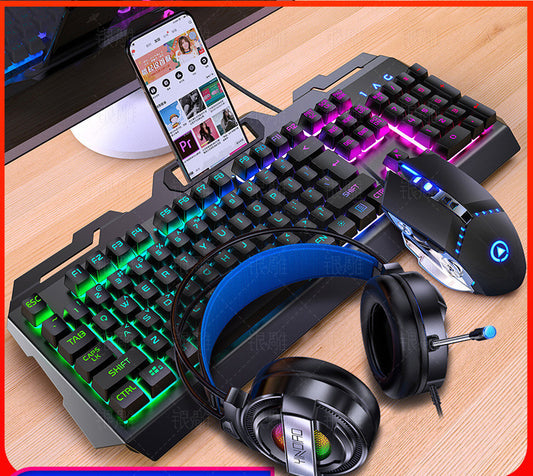 Gaming keyboard, mouse, and headphones on a wooden surface with a smartphone displaying a video.