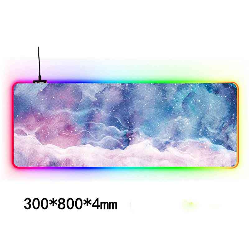 Large mouse pad with colorful LED lighting on a white background