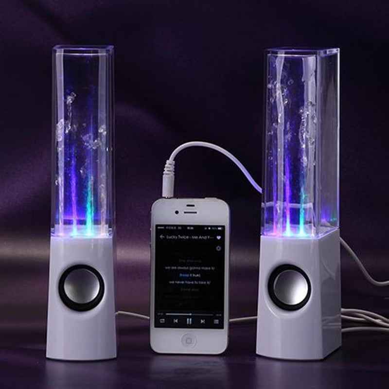Two water fountain speakers with a smartphone displaying music app on a dark background