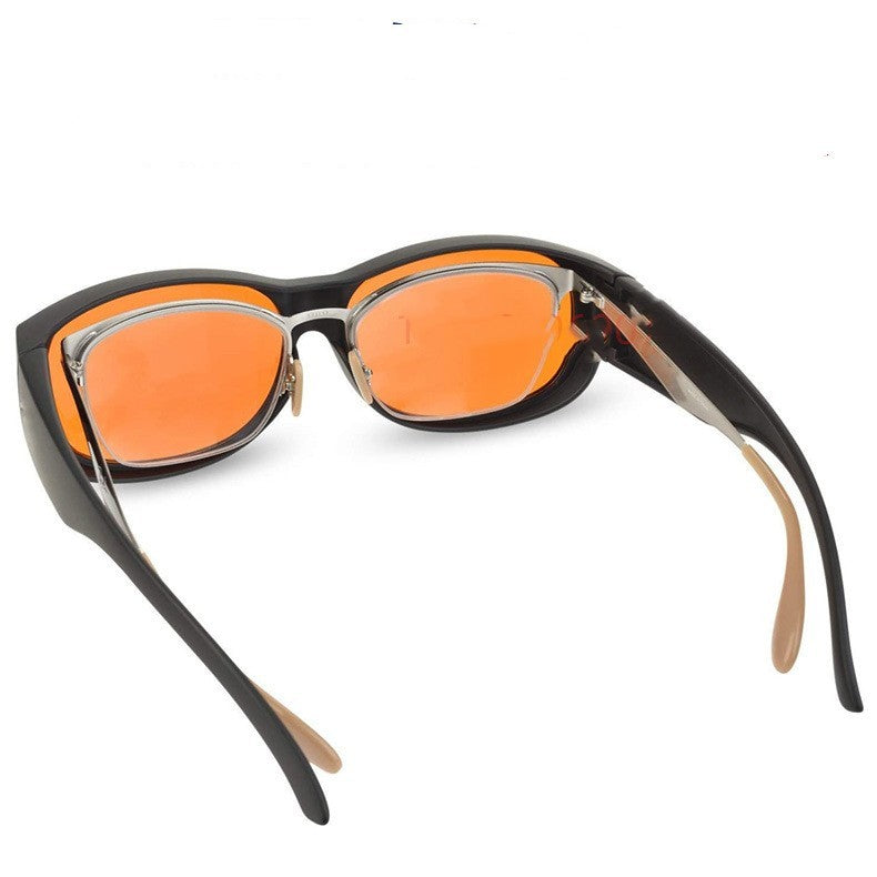 Sunglasses with black frame and orange lenses on a white background