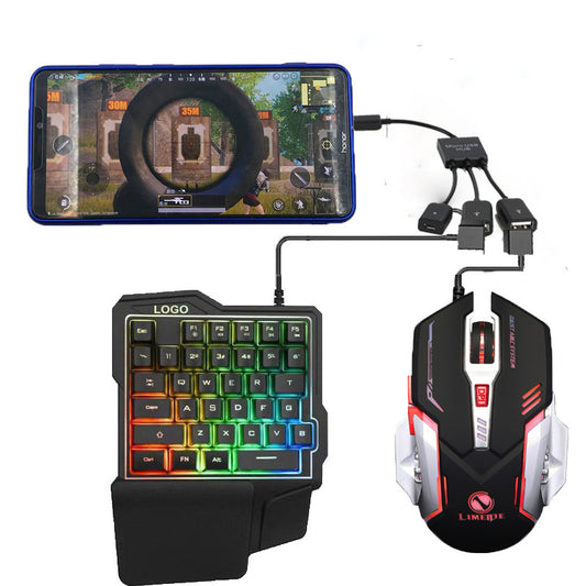 Gaming keyboard, mouse, and smartphone setup on a white background