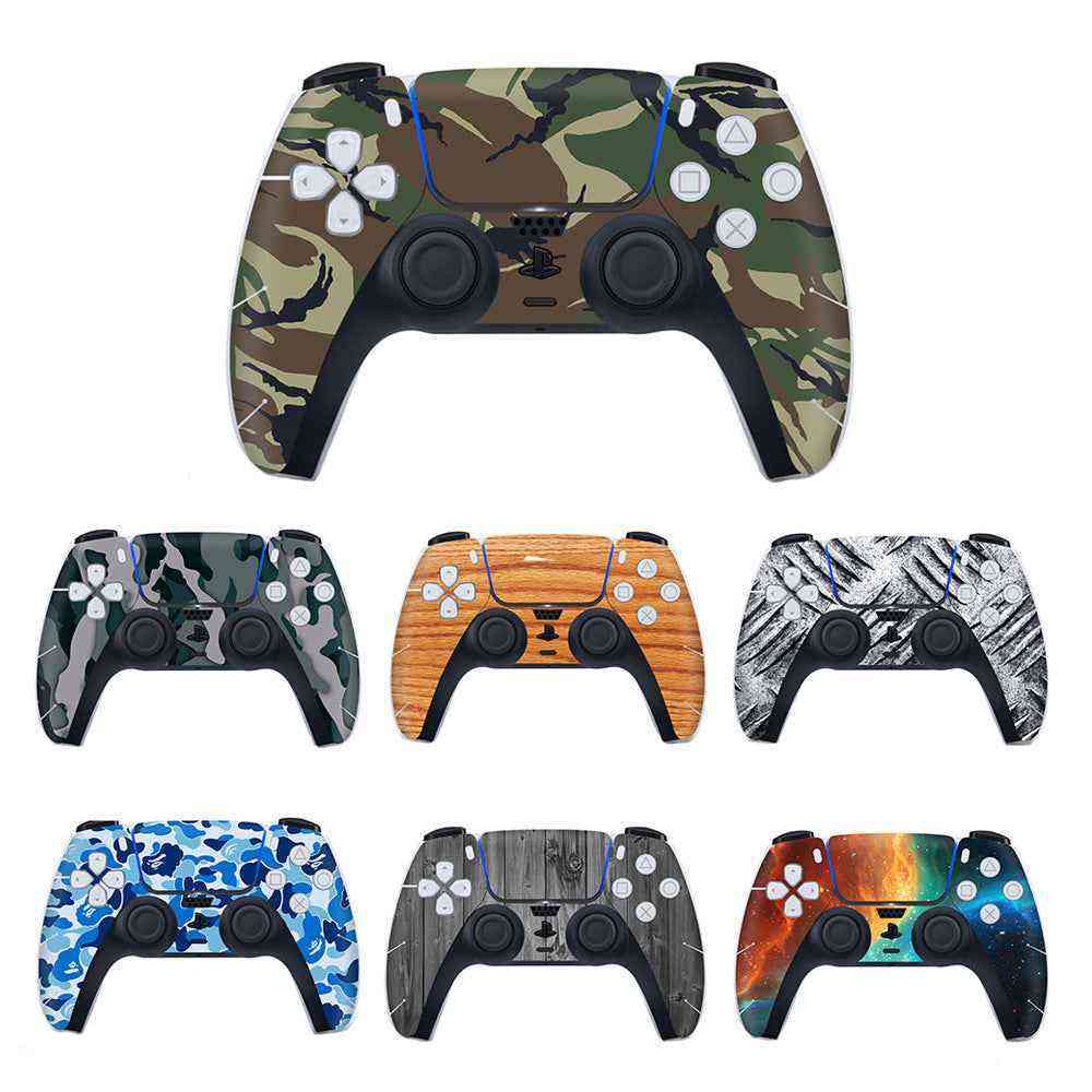 Collection of variously designed gaming controllers on a white background