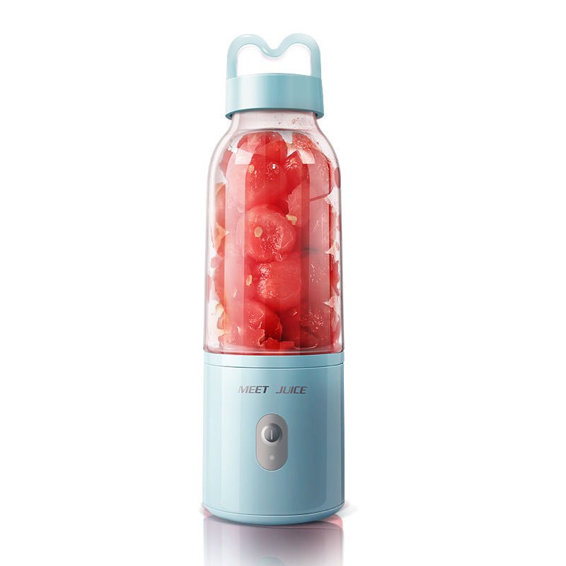 Portable blender with red fruit inside on a white background
