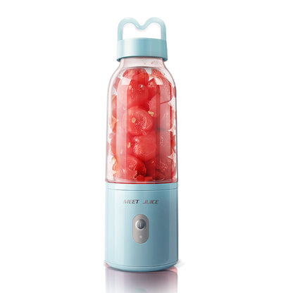 Portable blender with red fruit inside on a white background