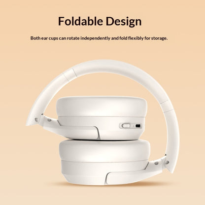 Foldable white headphones on a beige background with text about their design.