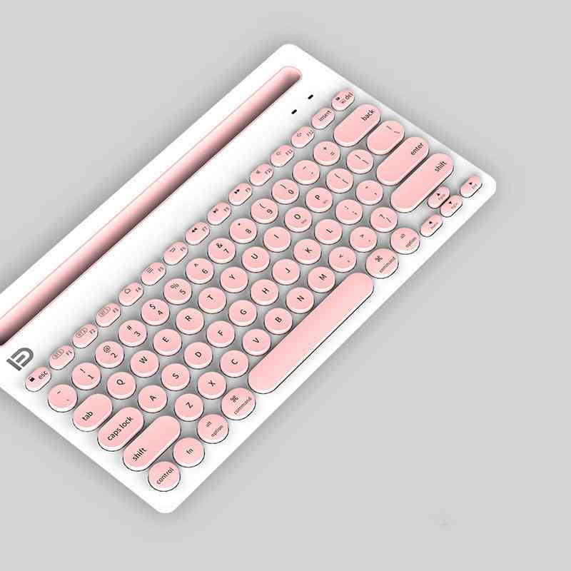Pink and white wireless bluetooth keyboard on a gray background