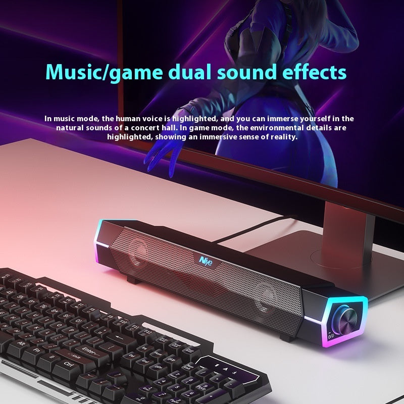 Sound bar with keyboard on desk, highlighting music/game dual sound effects.