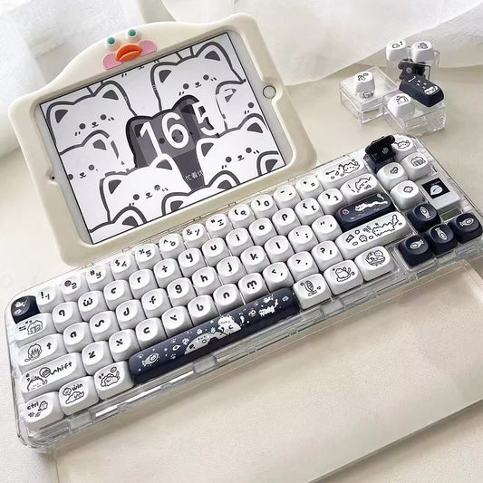 Keyboard with cartoon keycaps on a white surface