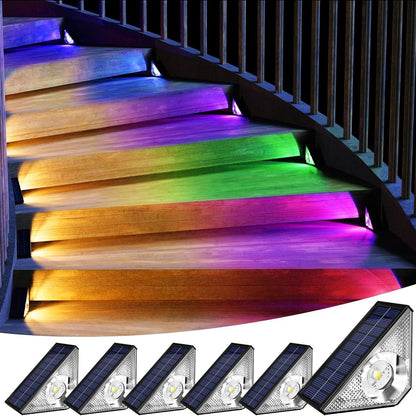 Colorful LED stair lights on a staircase with six solar panel lights at the bottom.