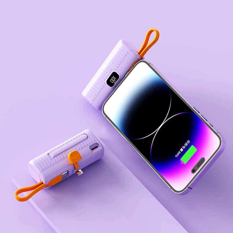 Smartphone with power bank on a light purple background