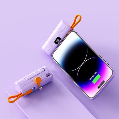 Smartphone with power bank on a light purple background