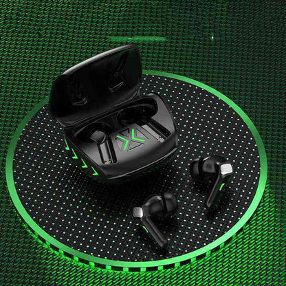 Black wireless earbuds with charging case on a green textured background
