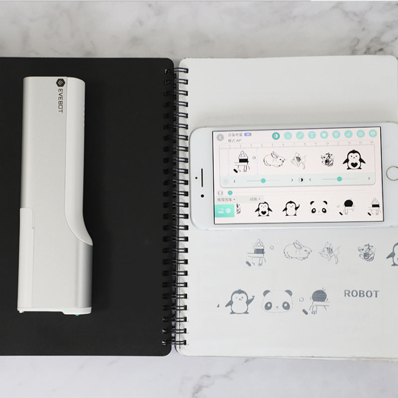 Notebook with a smartphone displaying app icons on a marble surface