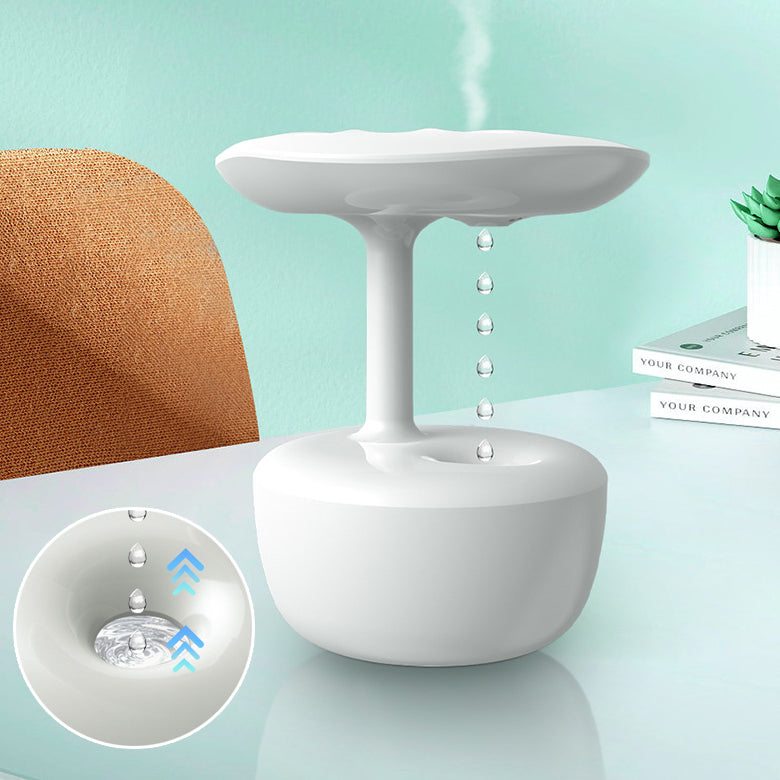 White humidifier on a table with a light blue background