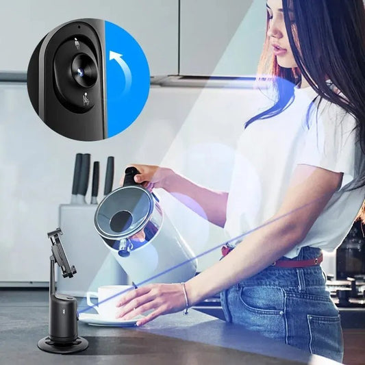 Person using a UV light device on a kitchen counter with a smartphone holder in the foreground.