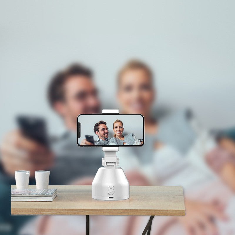 Smartphone on a stand with a blurred background of people using smartphones