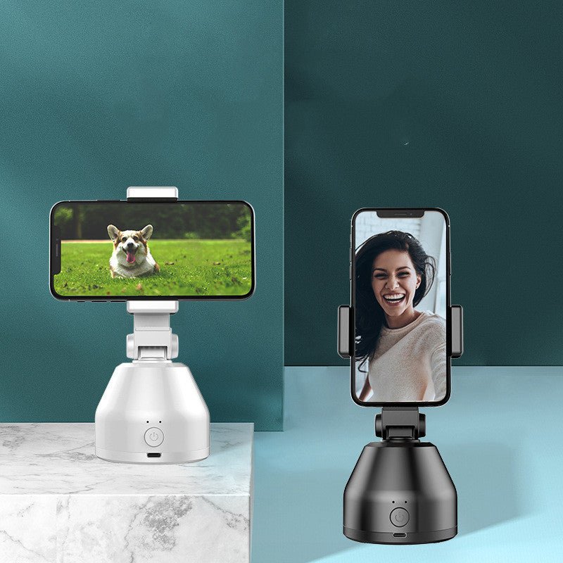 Two smartphone holders on stands displaying a dog and a person on their screens against a teal and light blue gradient background.