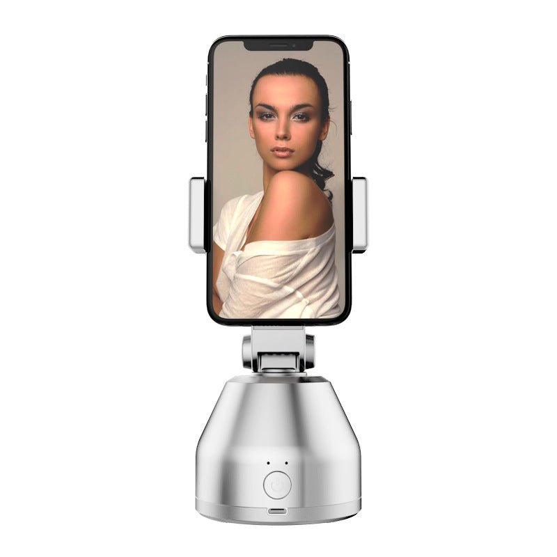 Phone holder with a smartphone displaying a woman's face on a white background