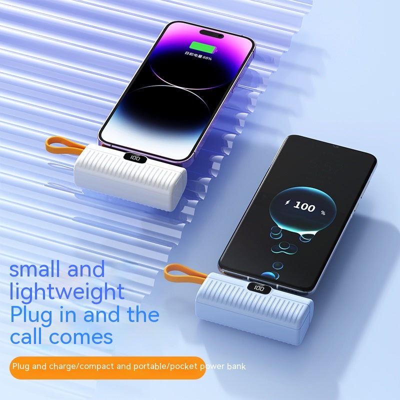 Portable power bank with smartphone on a blue background
