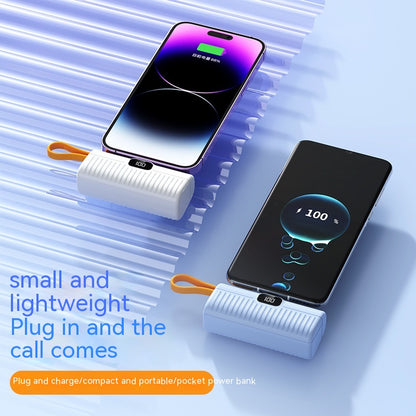 Portable power bank with smartphone on a blue background