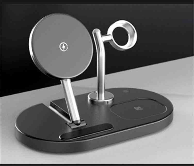 Multi-device charging stand with phone holder and wireless chargers on a dark background