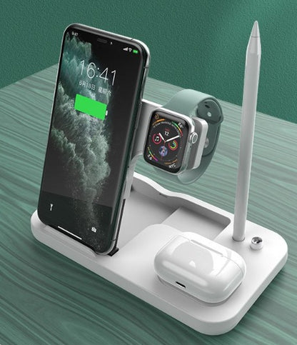 Multi-device charging stand with phone, watch, and airpods on a green surface