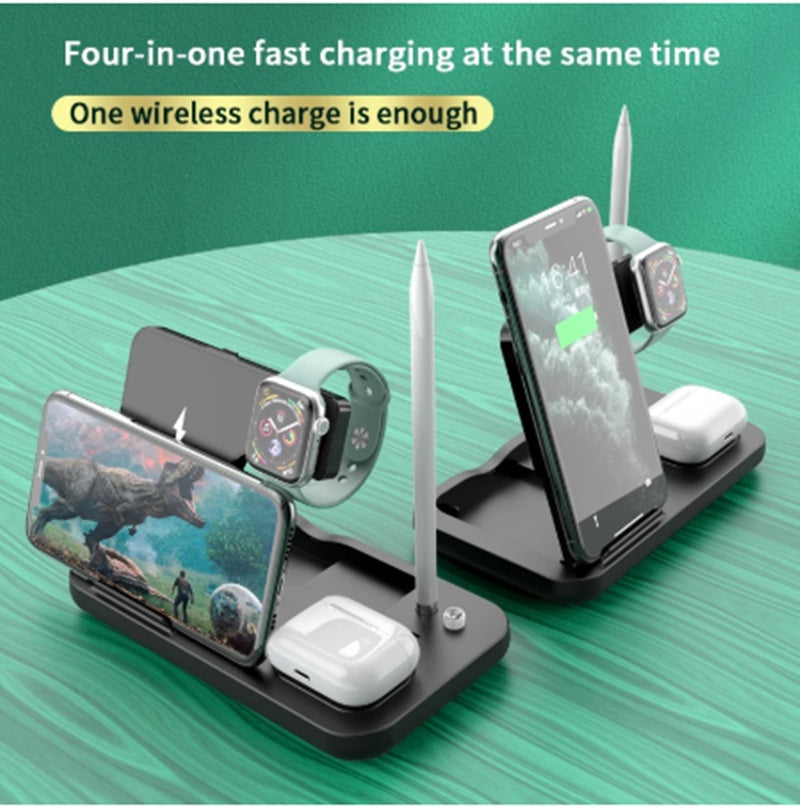 Multi-device charging station with phone, watch, and earbuds on a green surface