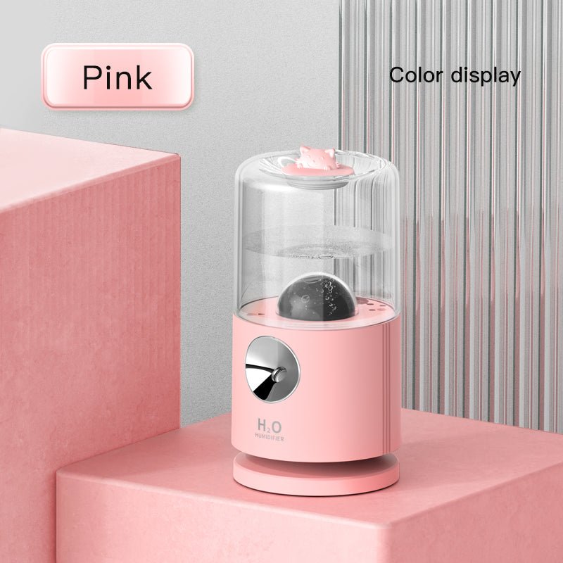 Pink electronic device with a clear top on a pink platform, labeled 'Pink' and 'Color display'.