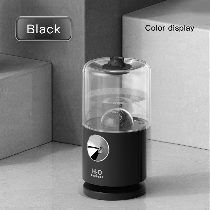 Black humidifier with clear top on a gray surface, labeled 'Black' and 'Color display'.