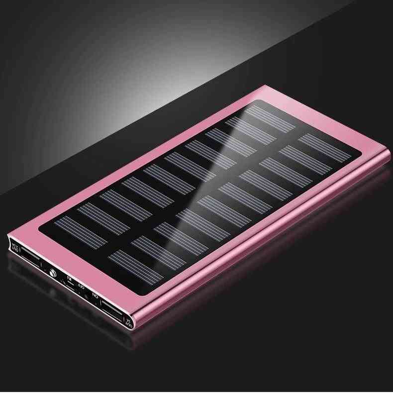 Pink solar power bank on a black background