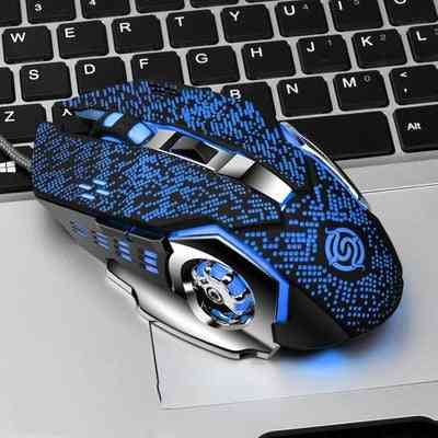 Blue and black gaming mouse on a laptop keyboard