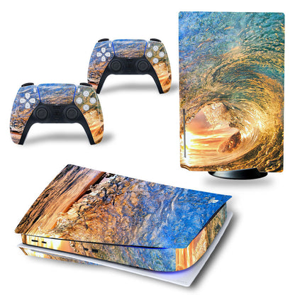 Gaming console and controllers with nature-themed skin design on a white background