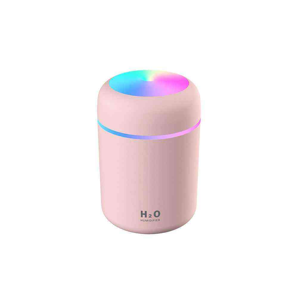 Pink humidifier with colorful LED light on a white background