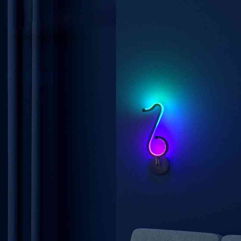 Neon light shaped like a musical note on a dark background