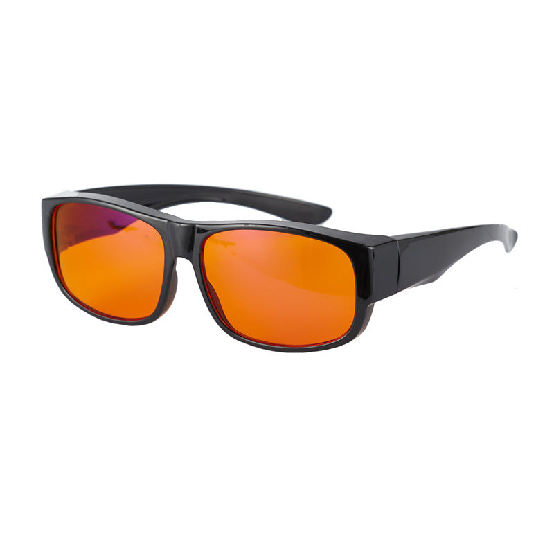 Sunglasses with black frame and orange lenses on a white background
