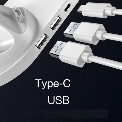 Close-up of a device with USB ports and Type-C cable, on a black background.